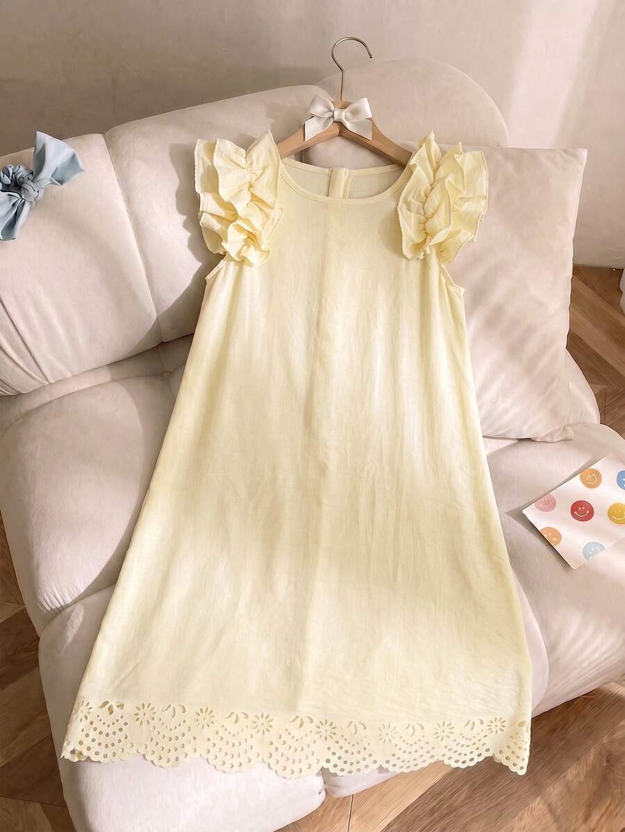 Tween girls apricot vacation midi dress featuring a round neck, cut out details, ruffle flounce accents, and geometric pattern.