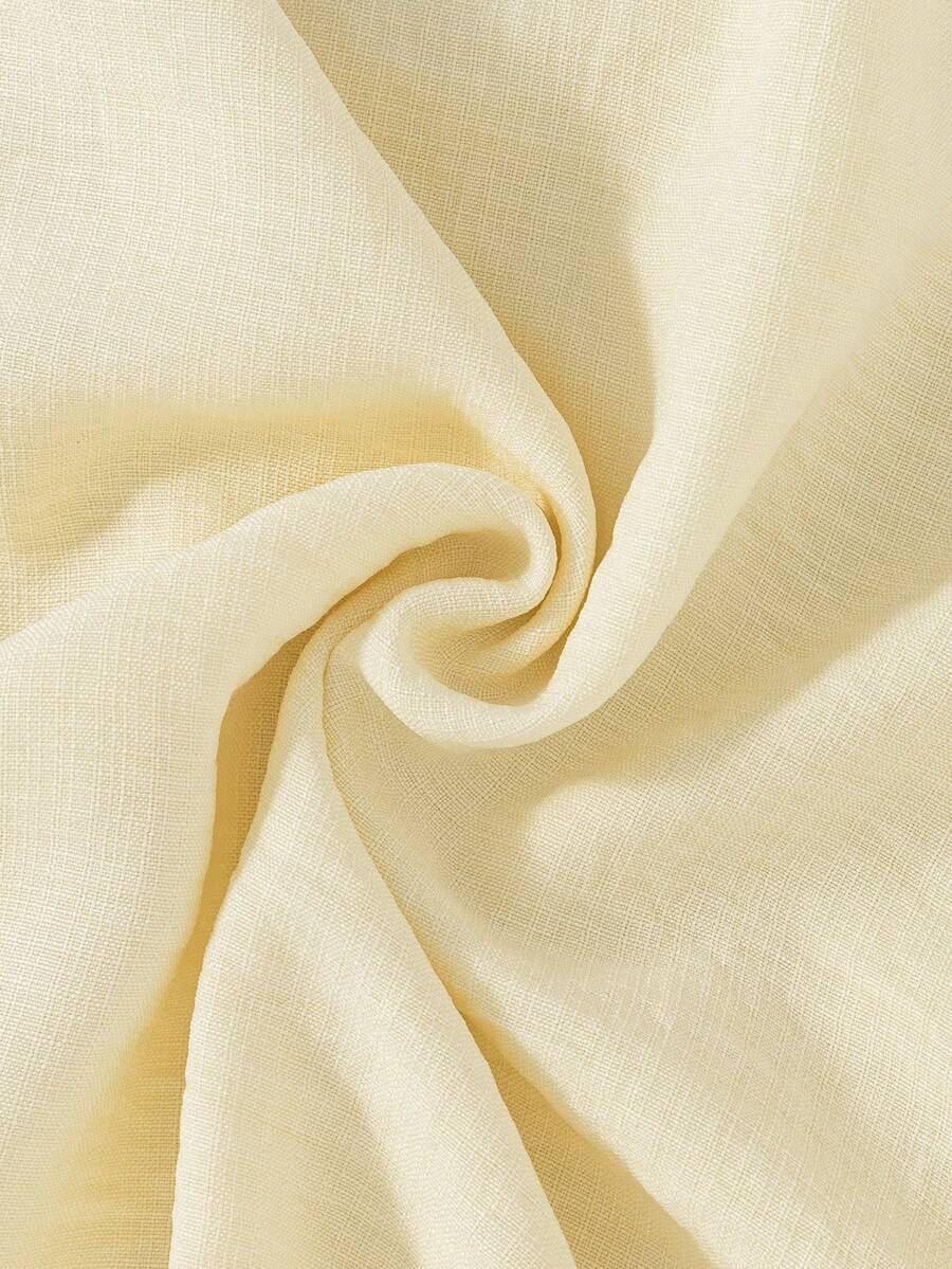 Tween girls apricot vacation midi dress featuring a round neck, cut out details, ruffle flounce accents, and geometric pattern.