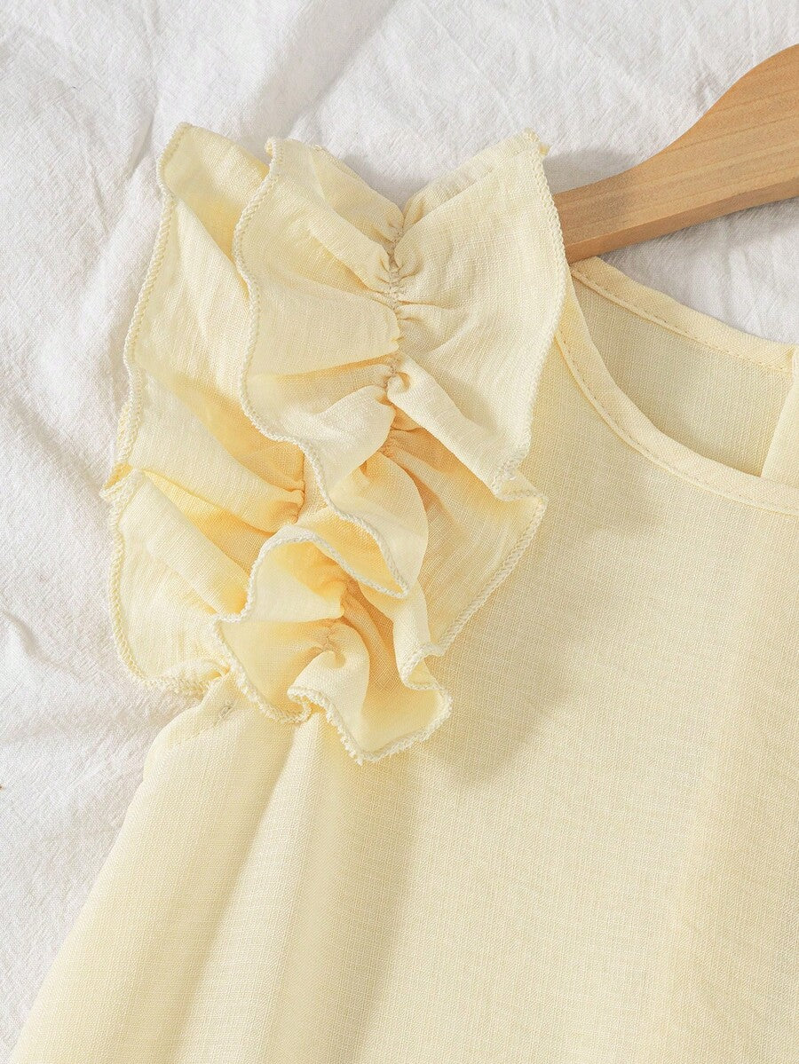 Tween girls apricot vacation midi dress featuring a round neck, cut out details, ruffle flounce accents, and geometric pattern.