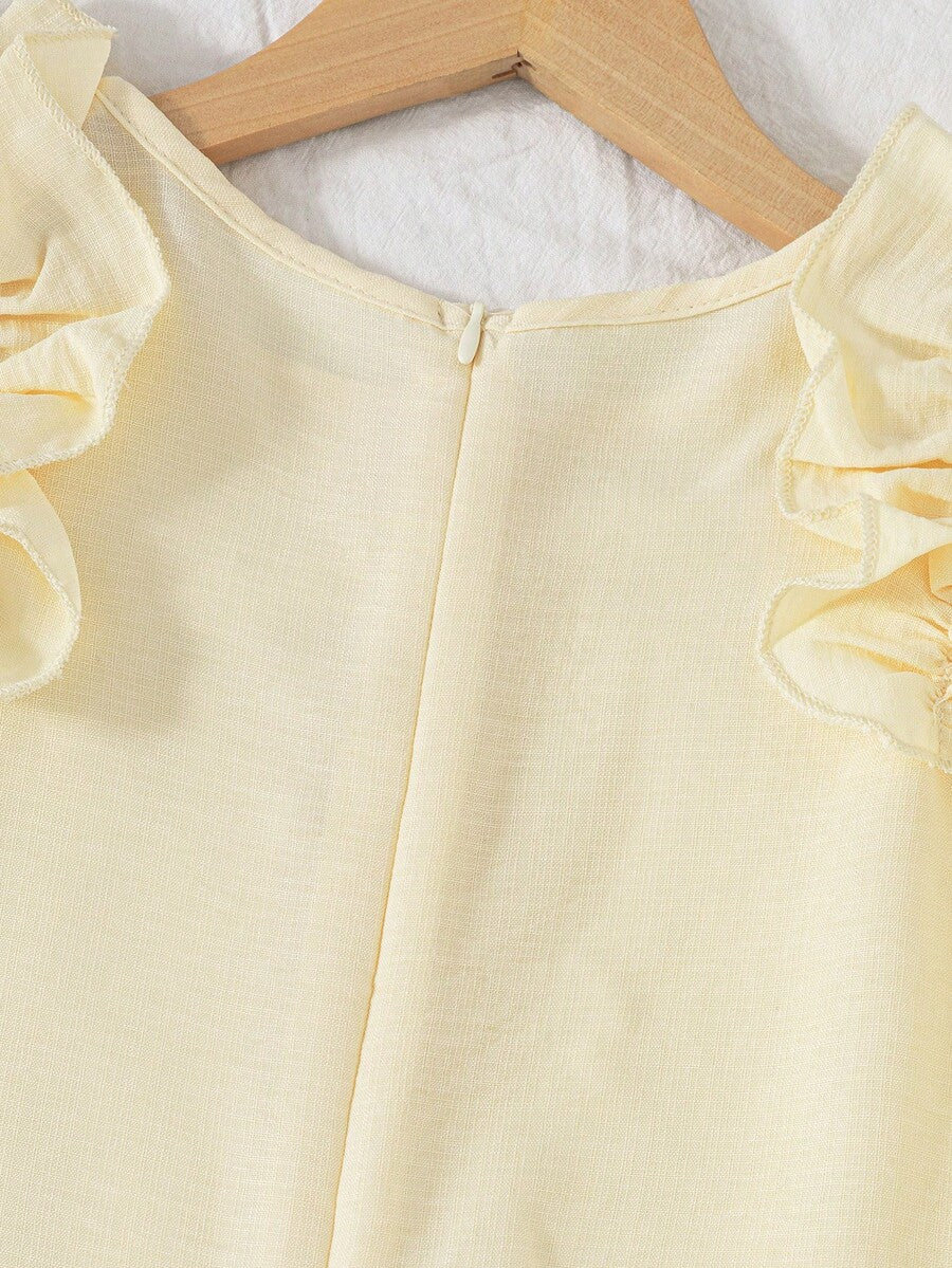 Tween girls apricot vacation midi dress featuring a round neck, cut out details, ruffle flounce accents, and geometric pattern.