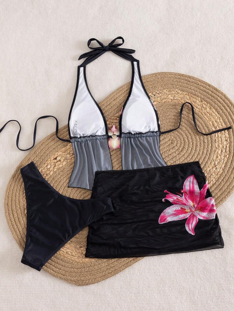Women's 3-piece floral bikini set featuring a multicolor plant print halter top with 3D rose detail, matching bikini bottoms, and short skirt cover-up