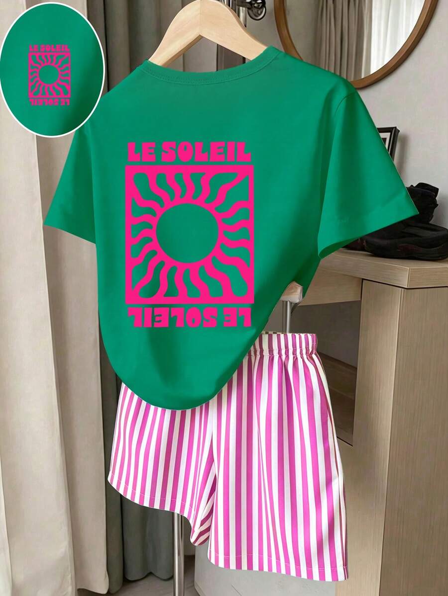 Girls' multicolor short sleeve T-shirt and shorts set featuring a cute cherry and bow print with round neck top and matching shorts.