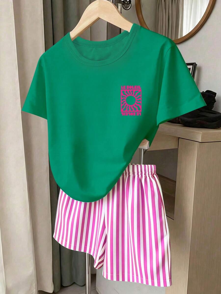 Girls' multicolor short sleeve T-shirt and shorts set featuring a cute cherry and bow print with round neck top and matching shorts.