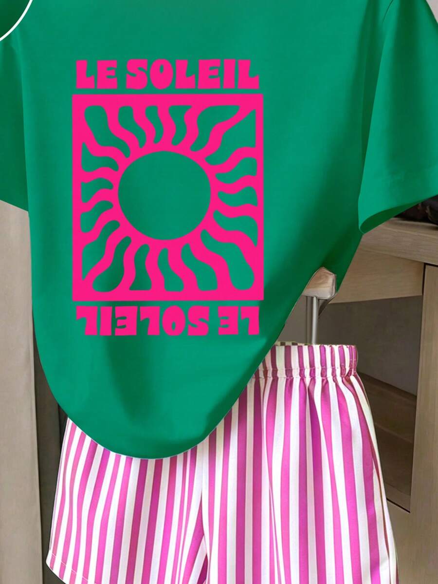 Girls' multicolor short sleeve T-shirt and shorts set featuring a cute cherry and bow print with round neck top and matching shorts.