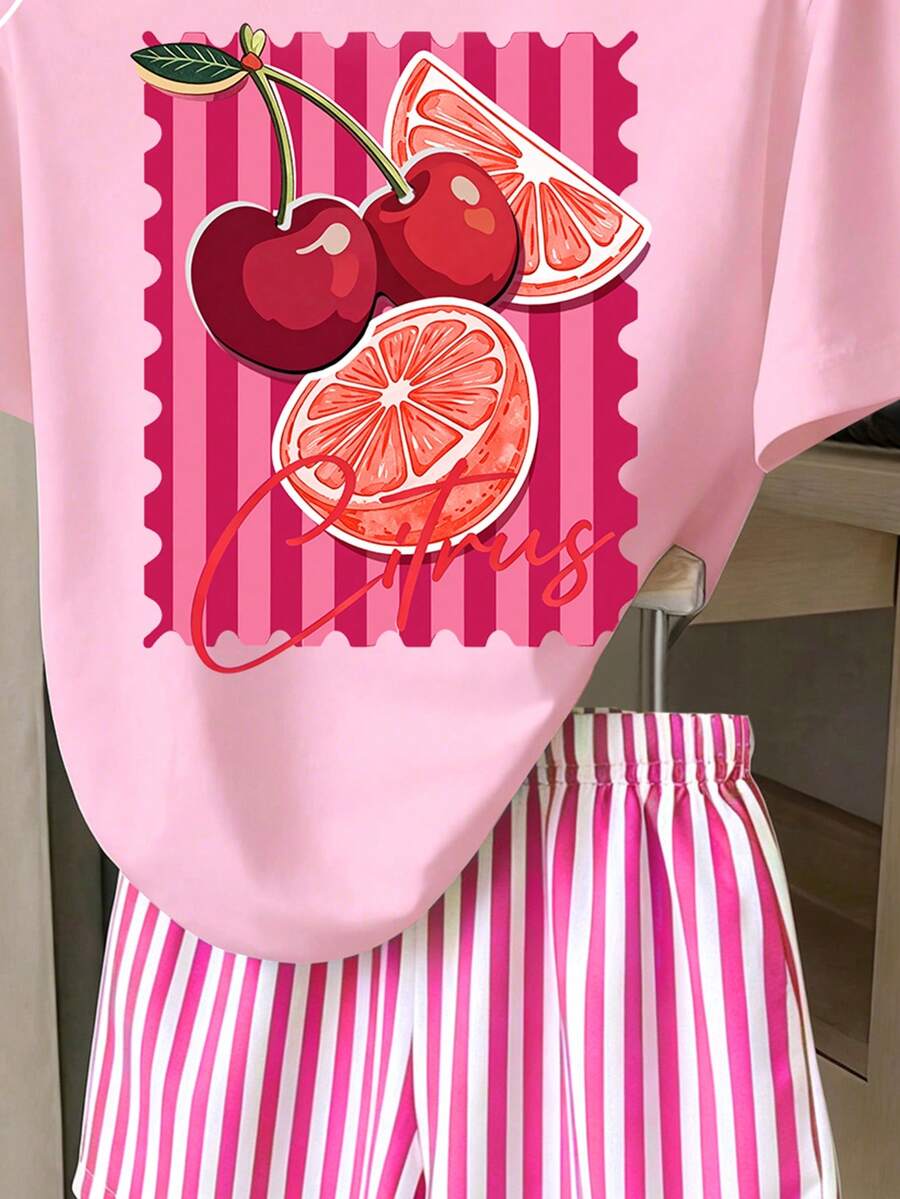 Girls' multicolor short sleeve T-shirt and shorts set featuring a cute cherry and bow print with round neck top and matching shorts.