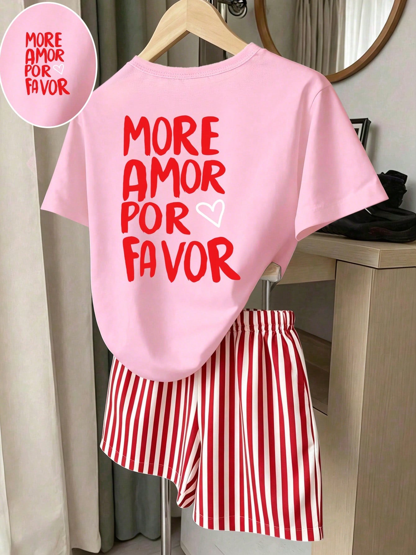 Girls' multicolor short sleeve T-shirt and shorts set featuring a cute cherry and bow print with round neck top and matching shorts.