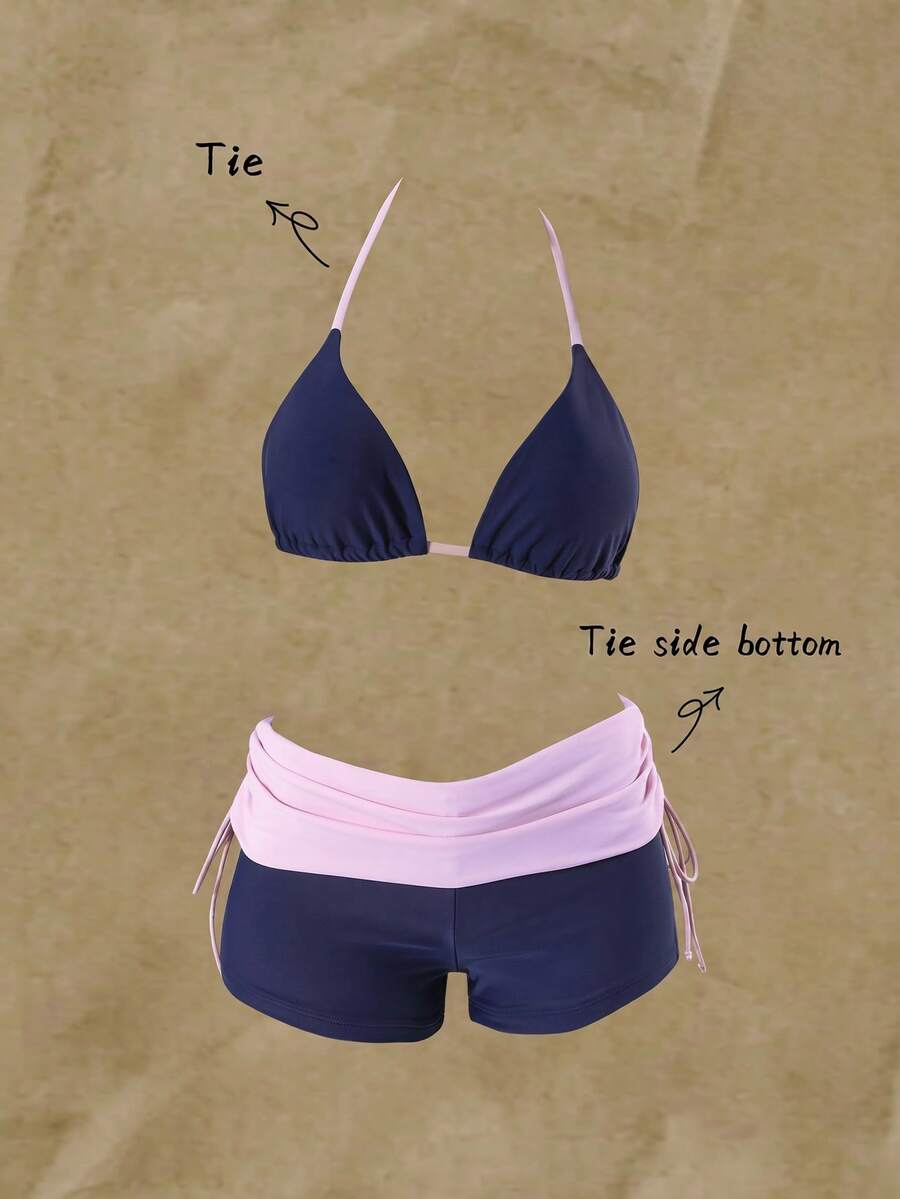 Women's halter triangle bikini top with knot detail paired with mid-waist colorblock swim shorts.