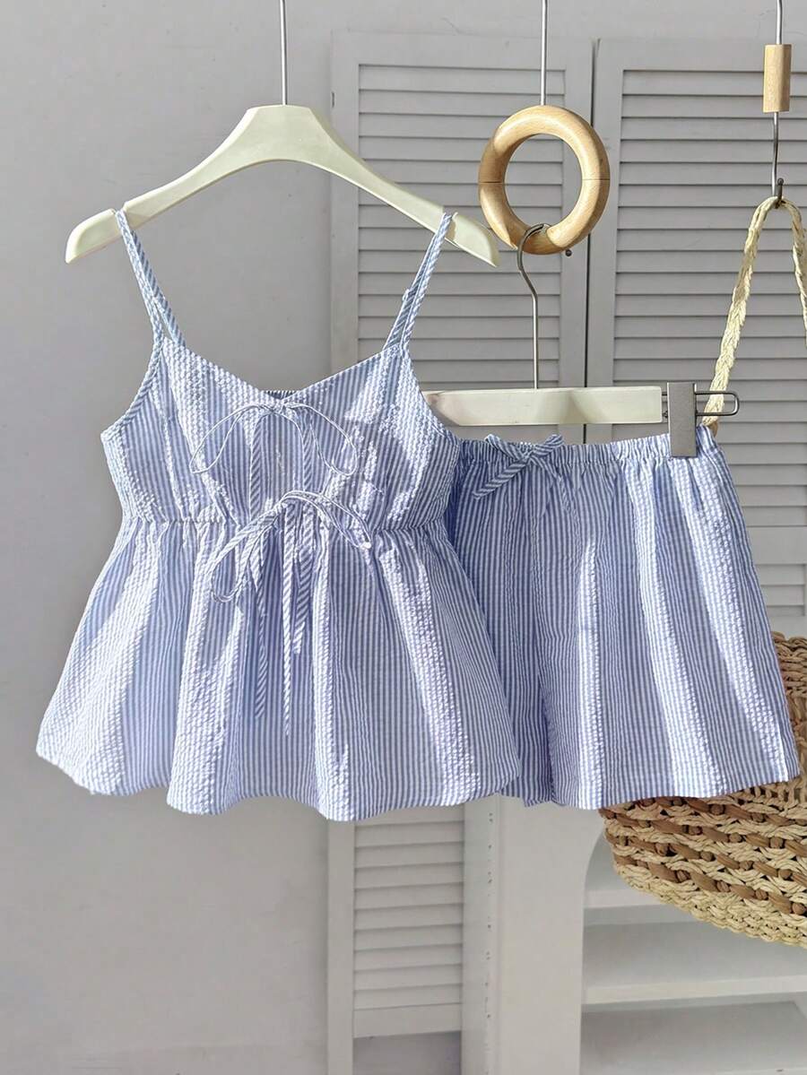 Tween girl 2-piece summer set with a black and white sleeveless striped spaghetti strap tank top with ruffle details and matching casual shorts.