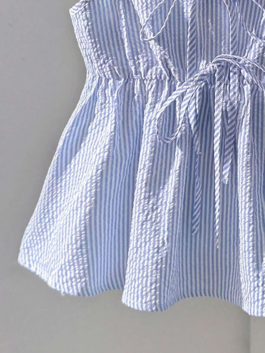 Tween girl 2-piece summer set with a black and white sleeveless striped spaghetti strap tank top with ruffle details and matching casual shorts.