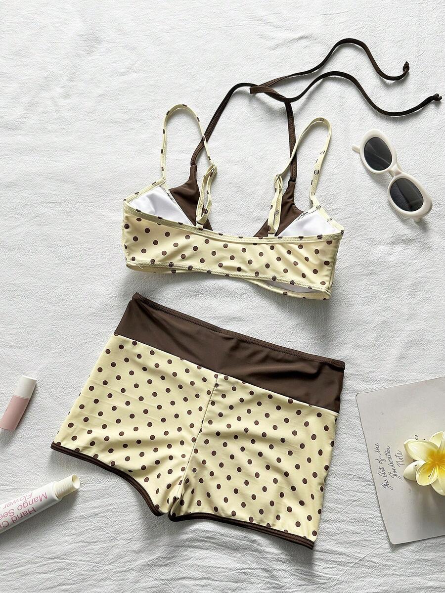 Women's retro pink and blue cartoon sardine print halter two-piece swimwear featuring a high waist shorts bottom and wireless bra with removable padding.