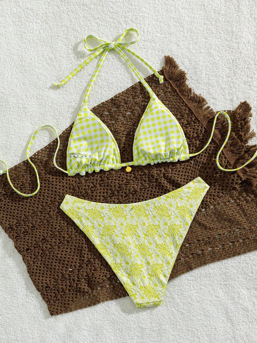 Women's black textured plaid 2-piece bikini set featuring a halter neckline, wireless triangle cups with removable padding, and mid-waist bottoms.