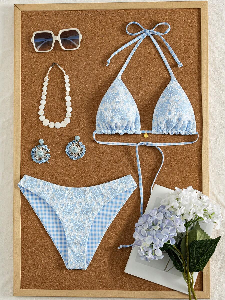 Women's black textured plaid 2-piece bikini set featuring a halter neckline, wireless triangle cups with removable padding, and mid-waist bottoms.