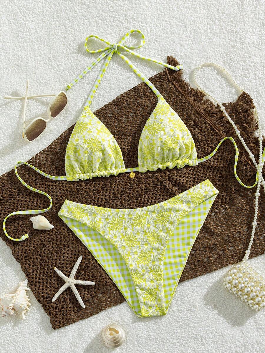 Women's black textured plaid 2-piece bikini set featuring a halter neckline, wireless triangle cups with removable padding, and mid-waist bottoms.