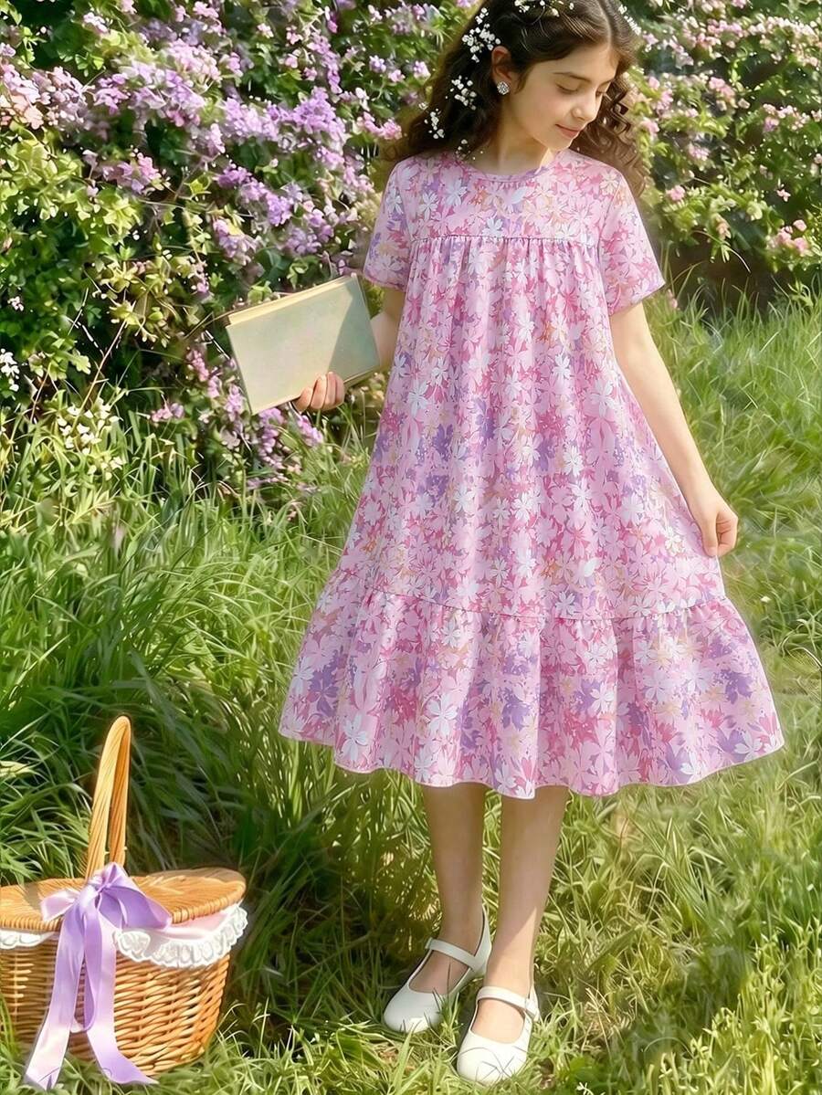 Tween girl wearing an Army Green textured short sleeve smock midi dress with round neck and ruffle flounce hem.