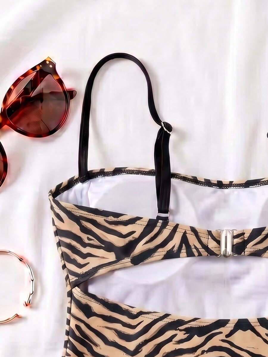 Black colorblock women's one-piece swimsuit with spaghetti straps and high stretch fabric.