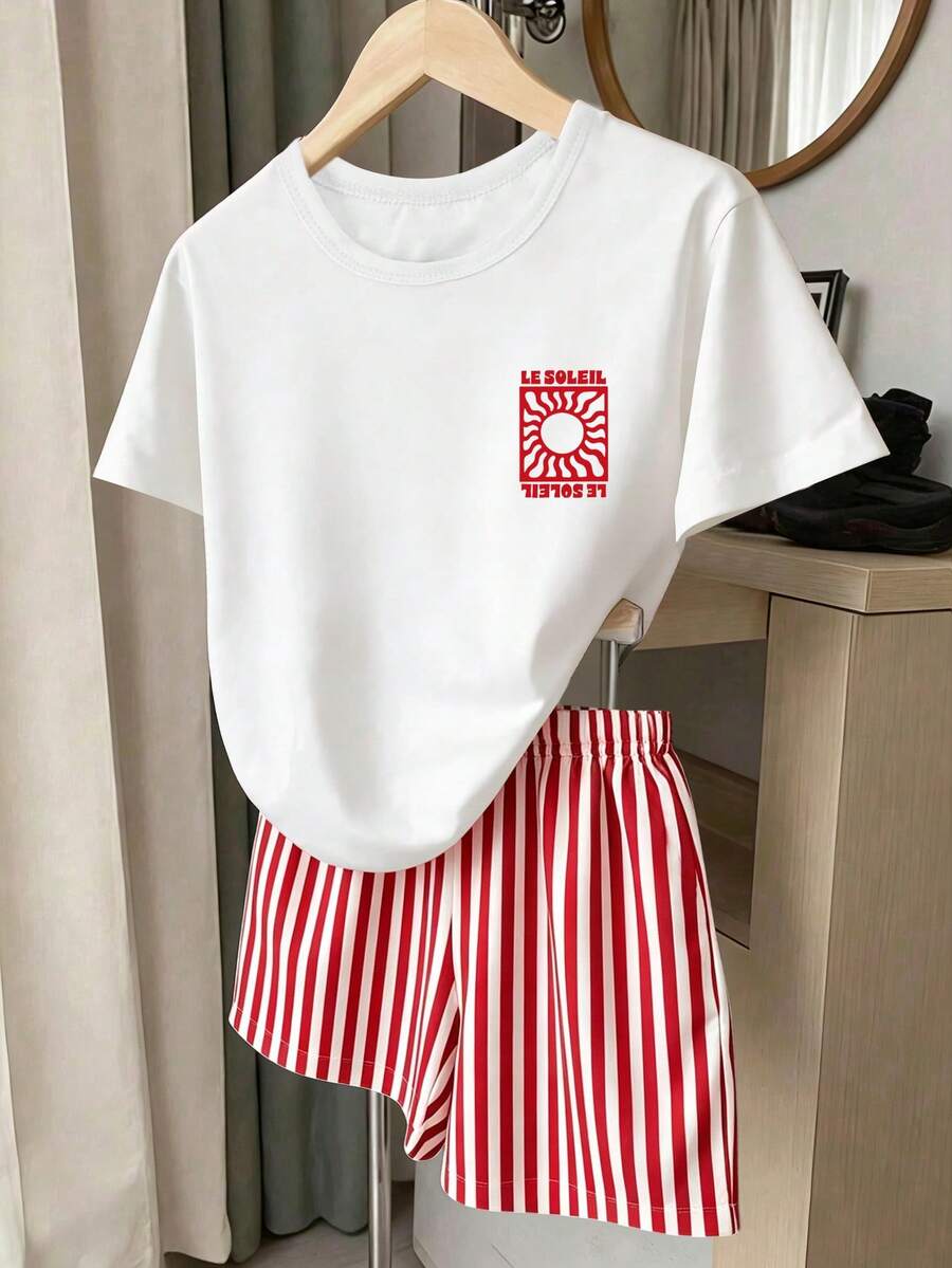 Girls' multicolor short sleeve T-shirt and shorts set featuring a cute cherry and bow print with round neck top and matching shorts.
