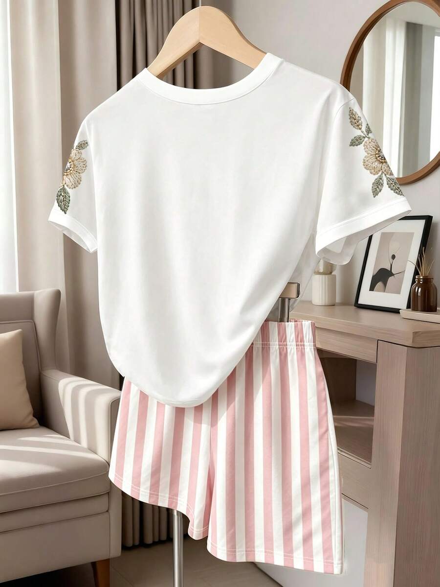 Girls' multicolor short sleeve T-shirt and shorts set featuring a cute cherry and bow print with round neck top and matching shorts.