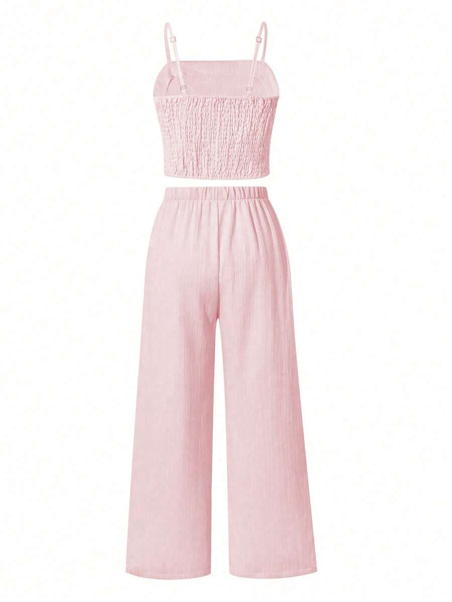 Tween girls casual 2-piece set featuring an apricot woven camisole crop top with back shirring and matching high-waisted loose long pants.