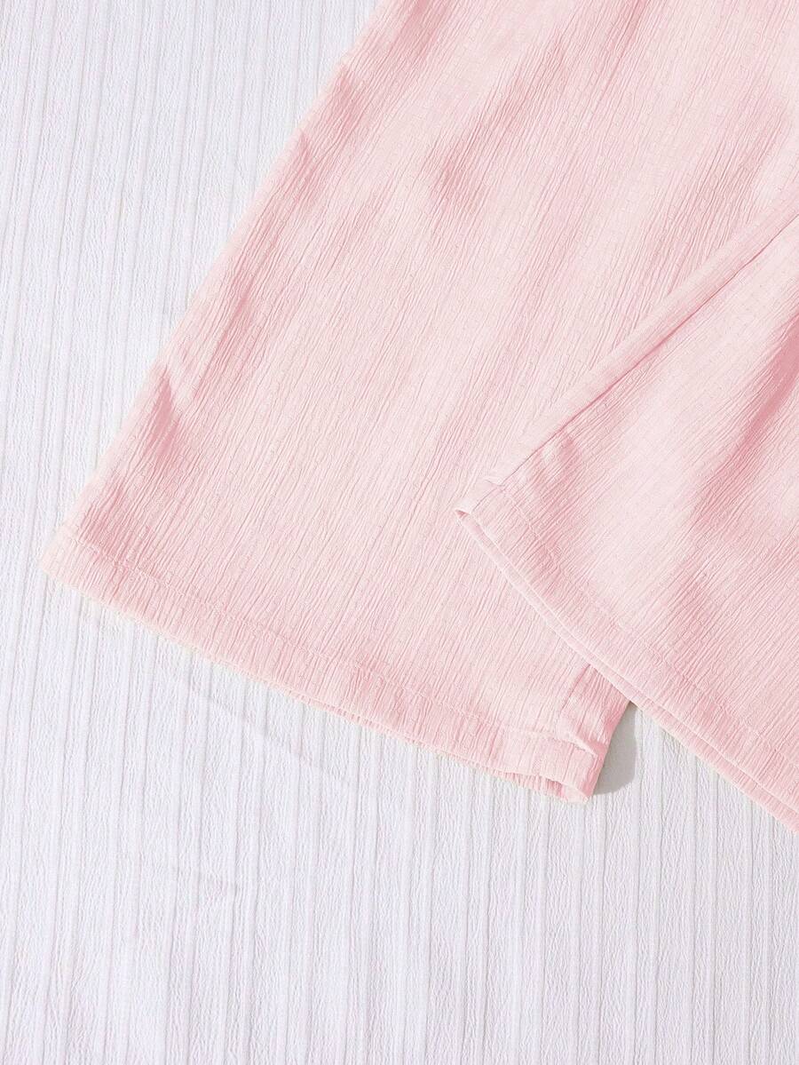 Tween girls casual 2-piece set featuring an apricot woven camisole crop top with back shirring and matching high-waisted loose long pants.
