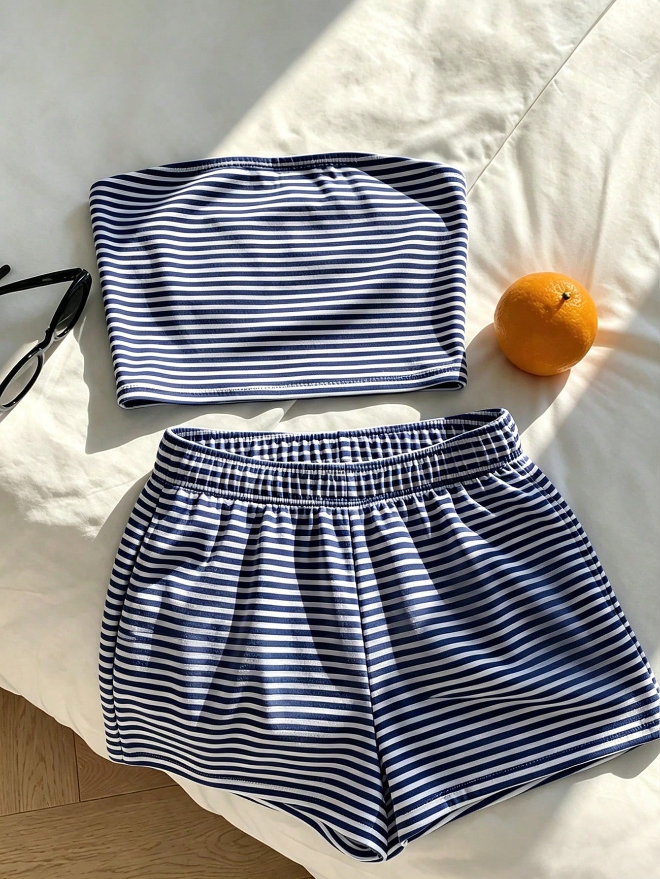 Tween girls two-piece summer outfit featuring a brown strapless tube top with contrast pink tape accent and matching brown shorts with pockets.