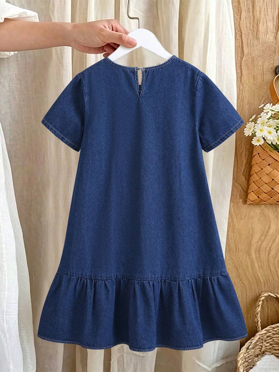 Tween girl wearing an Army Green textured short sleeve smock midi dress with round neck and ruffle flounce hem.