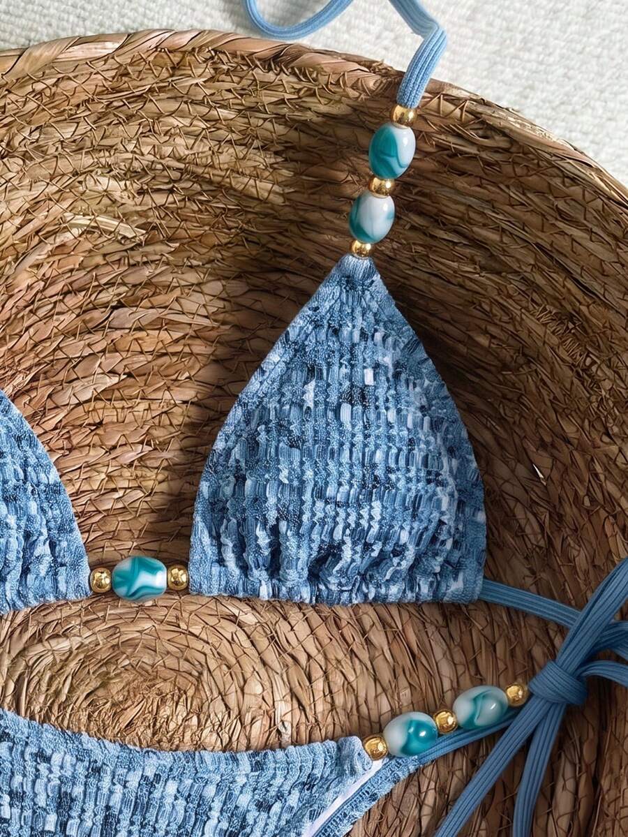 Multicolor textured beaded halter bikini set for women featuring wireless triangle cups with removable padding and ultra low waist tie side bottoms.