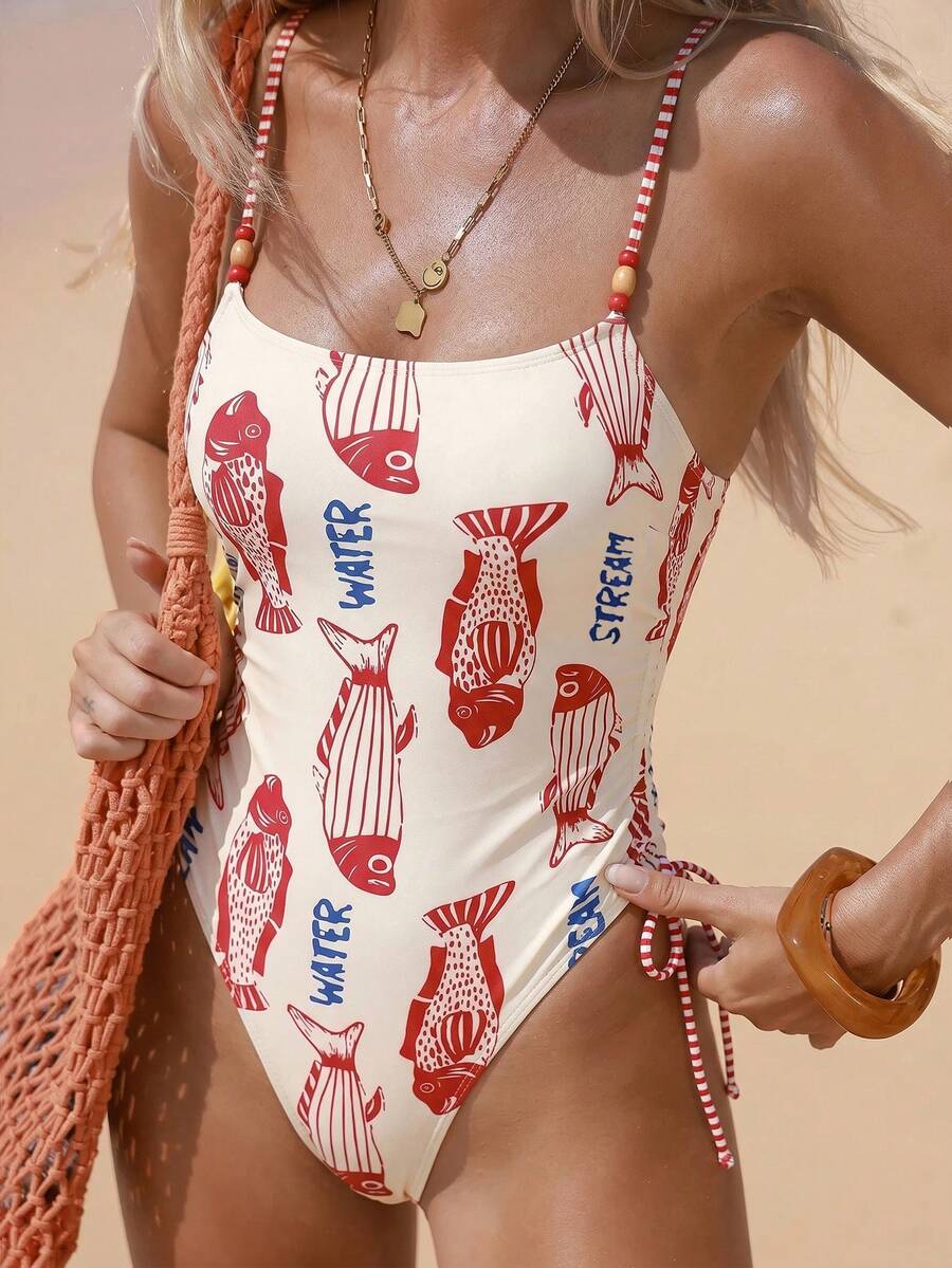 Women's blue backless one-piece swimsuit featuring spaghetti straps, wireless bra with removable padding, and drawstring details.