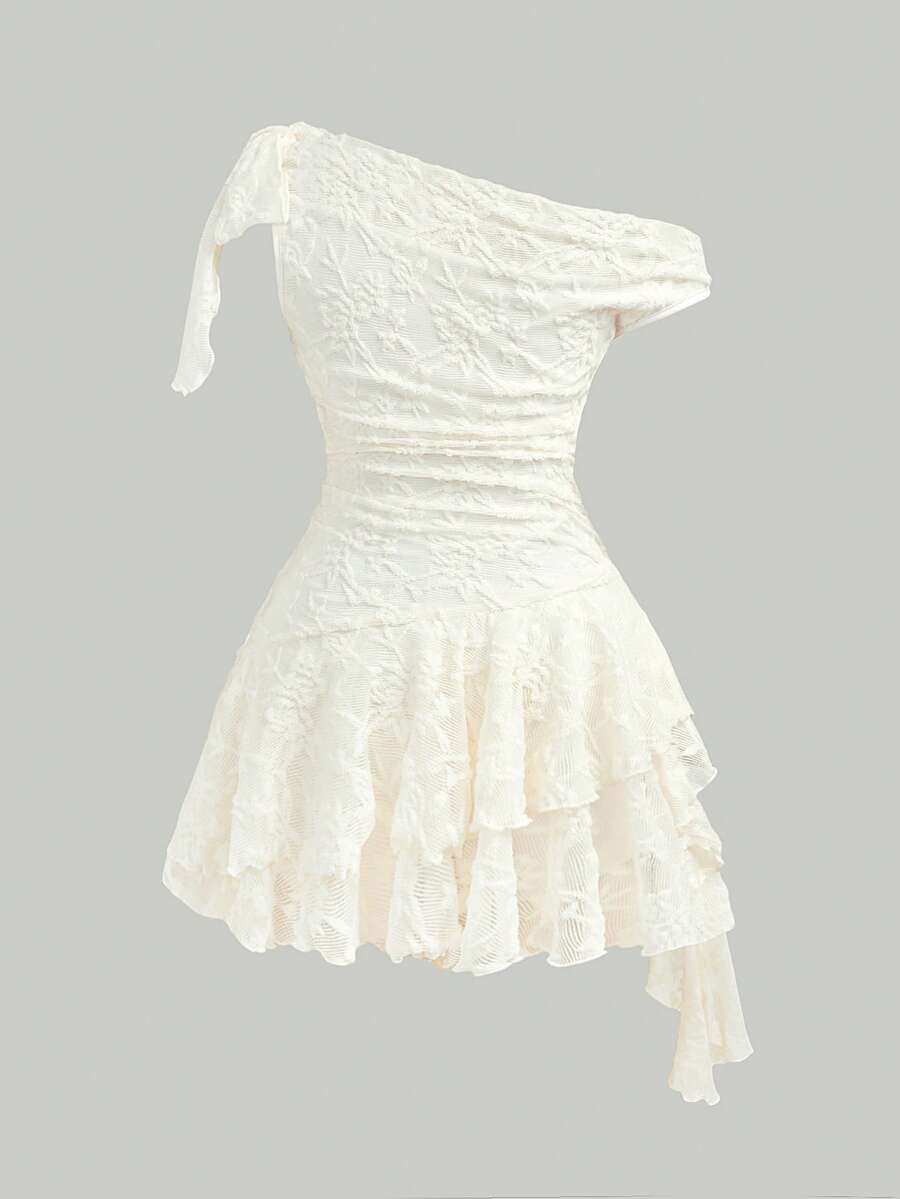 Tween girls sleeveless apricot A-line dress featuring an asymmetrical neck, contrast lace trim, and a flared hem.