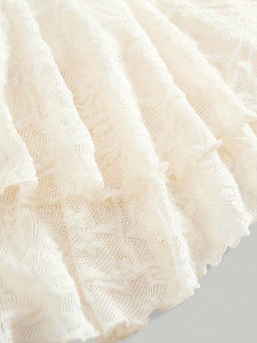 Tween girls sleeveless apricot A-line dress featuring an asymmetrical neck, contrast lace trim, and a flared hem.