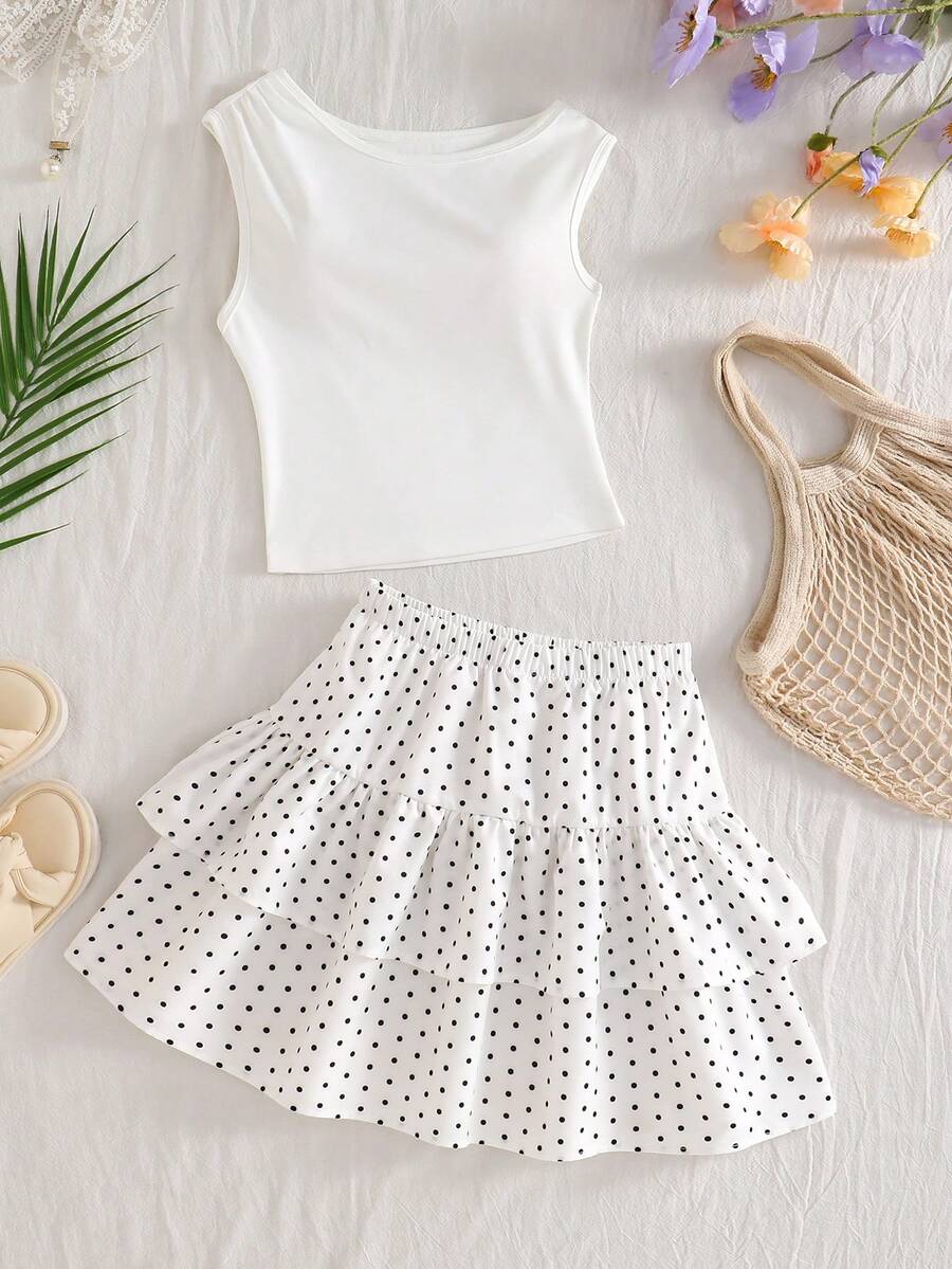 Light blue two-piece outfit set for tween girls with a sleeveless round neck vest top and a tiered ruffle cake skirt featuring a plant pattern.