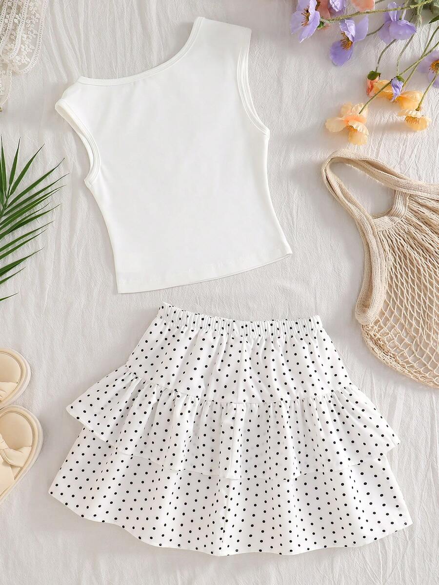 Light blue two-piece outfit set for tween girls with a sleeveless round neck vest top and a tiered ruffle cake skirt featuring a plant pattern.
