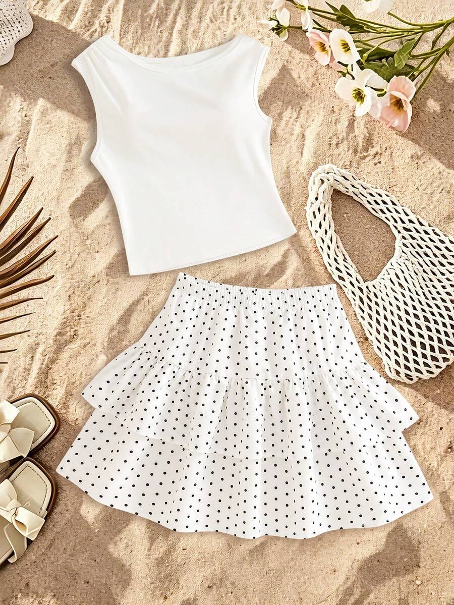 Light blue two-piece outfit set for tween girls with a sleeveless round neck vest top and a tiered ruffle cake skirt featuring a plant pattern.