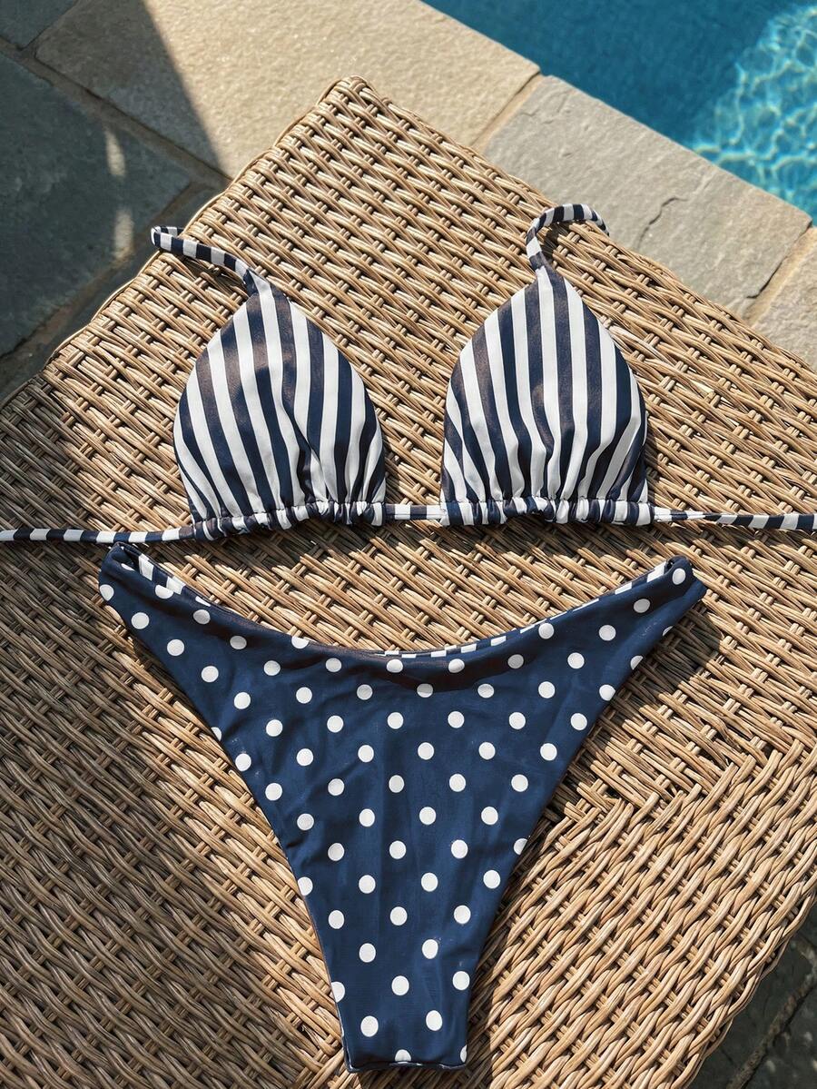 Women's two-piece halter bikini set featuring high cut thong bottoms and removable padding