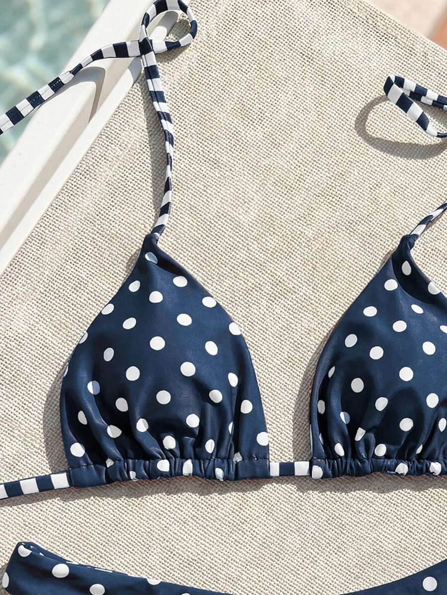 Women's two-piece halter bikini set featuring high cut thong bottoms and removable padding