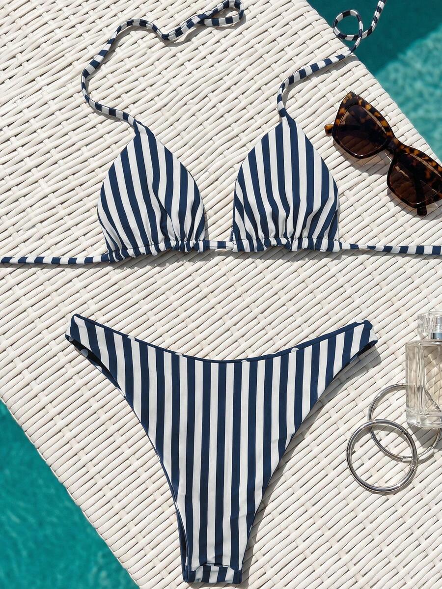 Women's two-piece halter bikini set featuring high cut thong bottoms and removable padding