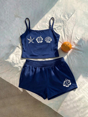 Tween girls summer 2-piece Hawaiian style outfit featuring a graphic print spaghetti strap camisole top with contrast piping and matching casual shorts.