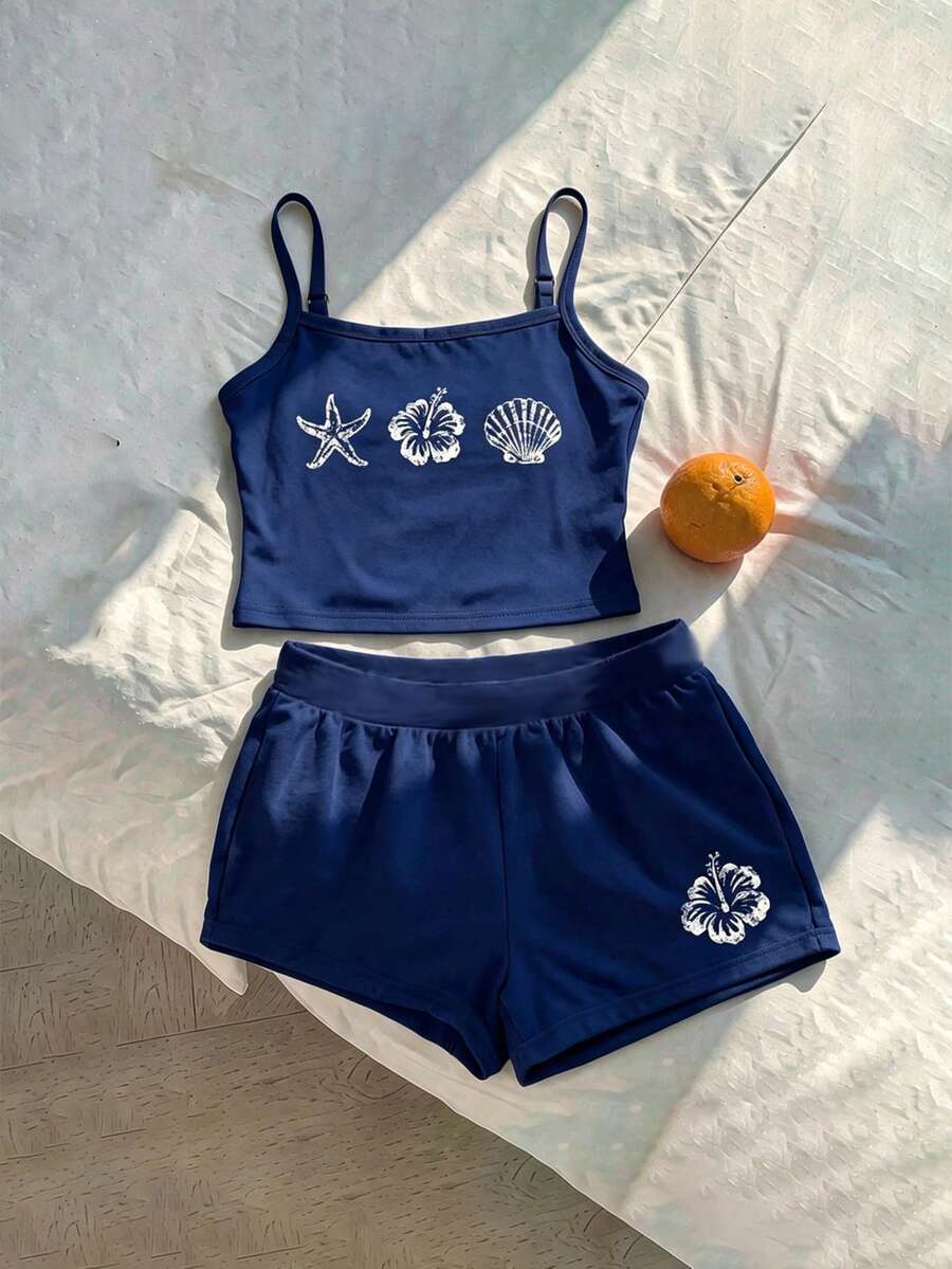 Tween girls summer 2-piece Hawaiian style outfit featuring a graphic print spaghetti strap camisole top with contrast piping and matching casual shorts.