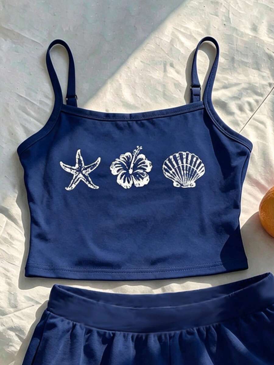 Tween girls summer 2-piece Hawaiian style outfit featuring a graphic print spaghetti strap camisole top with contrast piping and matching casual shorts.