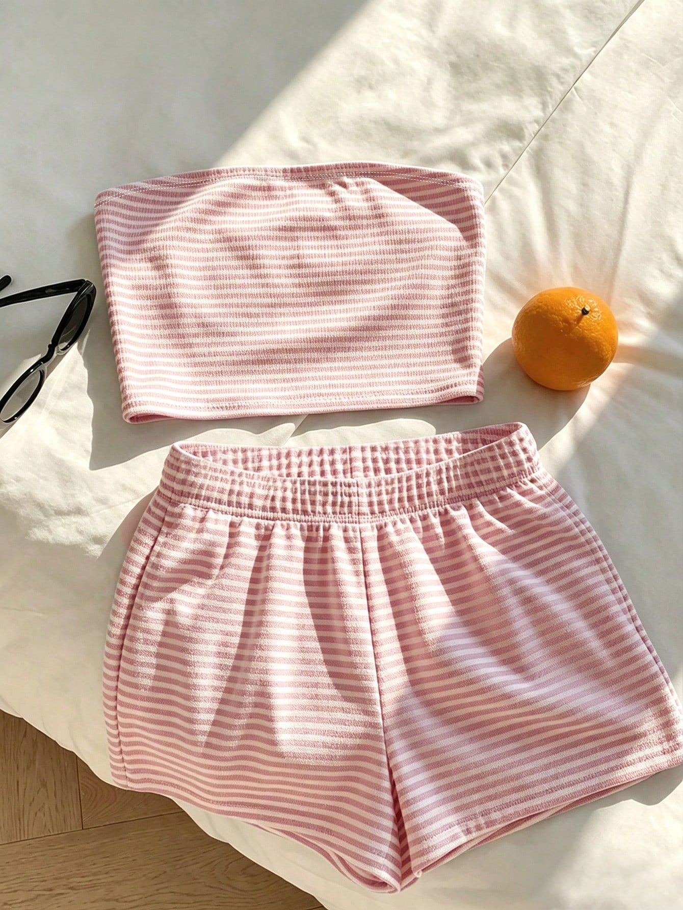 Tween girls two-piece summer outfit featuring a brown strapless tube top with contrast pink tape accent and matching brown shorts with pockets.