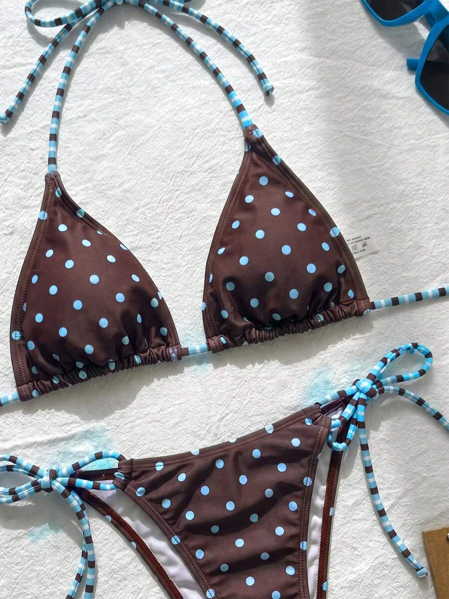 Women's black and white zebra print two-piece bikini set featuring a high waist tie-side bottom and a backless halter top with removable padding.
