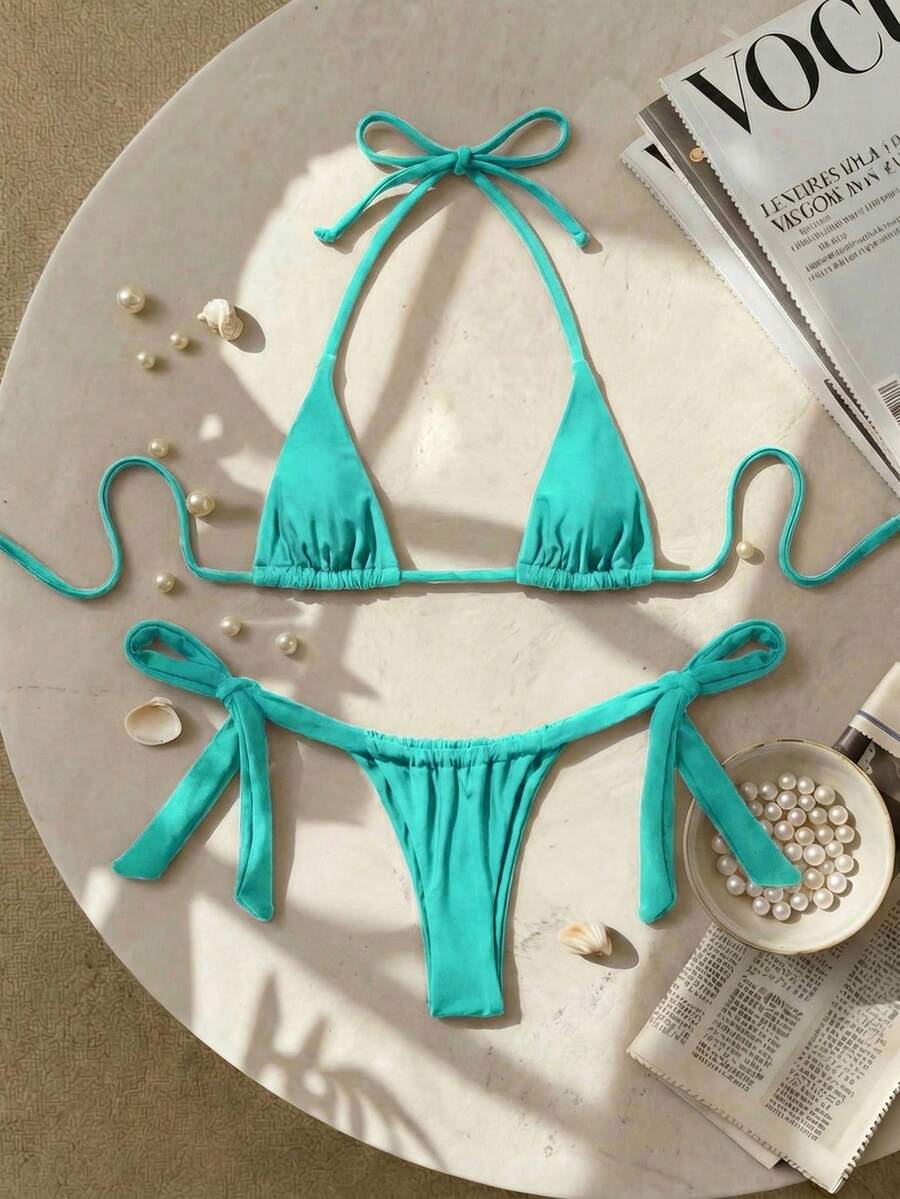 Army green high waist micro bikini swimsuit set for women featuring wireless spaghetti strap top with chain knot details and tie side thong bottoms.
