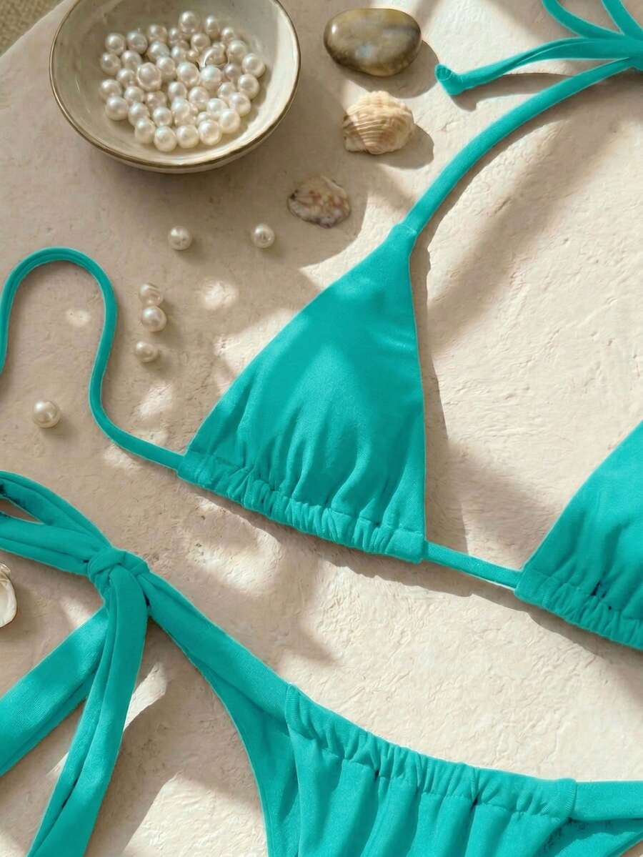 Army green high waist micro bikini swimsuit set for women featuring wireless spaghetti strap top with chain knot details and tie side thong bottoms.