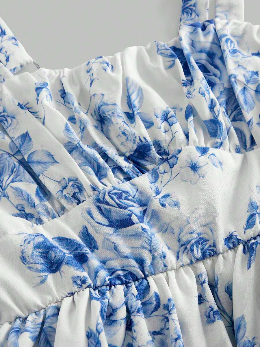 Tween girls blue ditsy floral sleeveless long dress with spaghetti straps, ruched bust, high waist, and tiered layered hem.