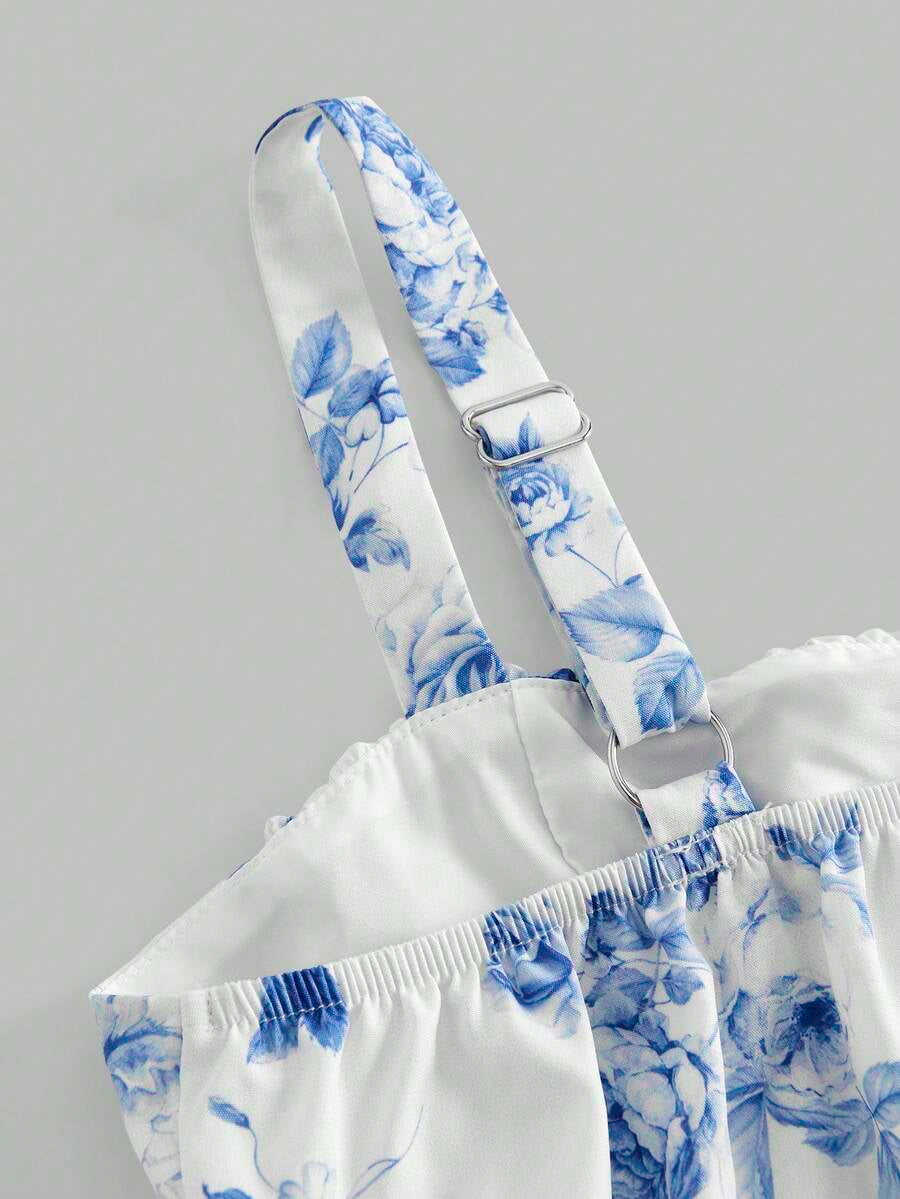 Tween girls blue ditsy floral sleeveless long dress with spaghetti straps, ruched bust, high waist, and tiered layered hem.