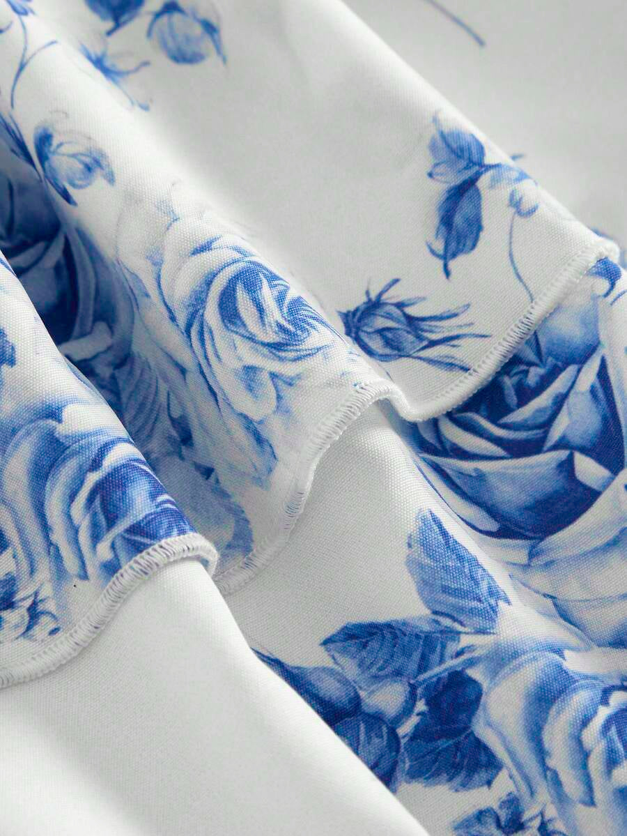 Tween girls blue ditsy floral sleeveless long dress with spaghetti straps, ruched bust, high waist, and tiered layered hem.
