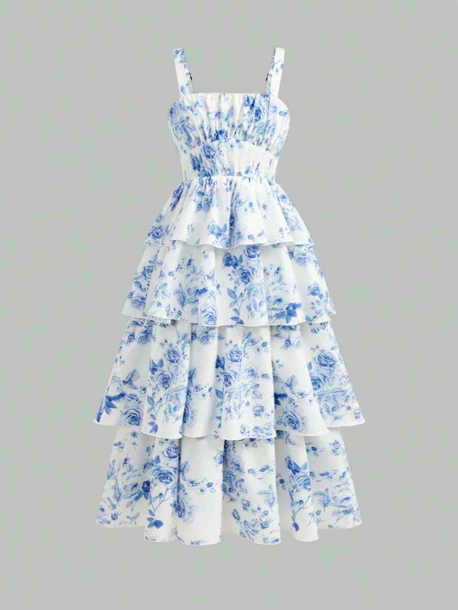 Tween girls blue ditsy floral sleeveless long dress with spaghetti straps, ruched bust, high waist, and tiered layered hem.