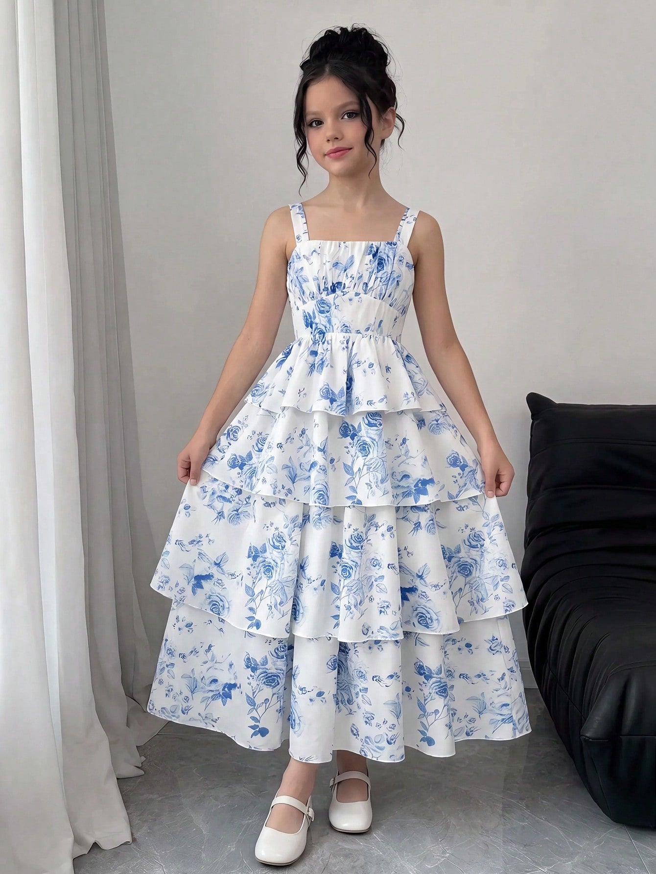 Tween girls blue ditsy floral sleeveless long dress with spaghetti straps, ruched bust, high waist, and tiered layered hem.