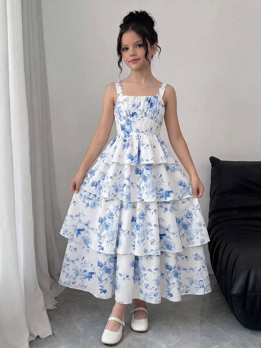 Tween girls blue ditsy floral sleeveless long dress with spaghetti straps, ruched bust, high waist, and tiered layered hem.