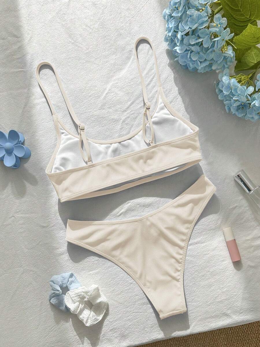 Apricot ribbed high waist two piece bikini swimsuit set for women featuring backless spaghetti strap top and high waisted bottoms.