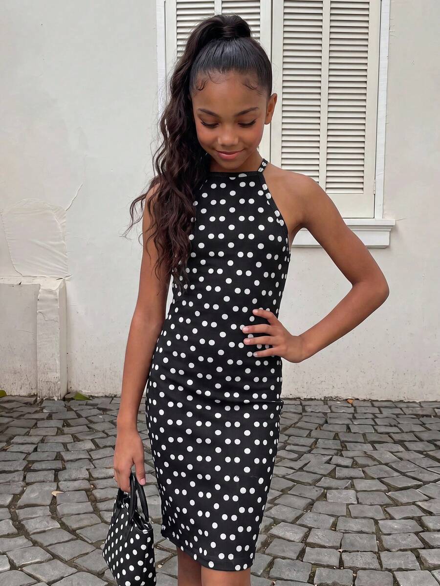 Tween girl black mini dress with halter neckline, backless design, tiered layer detail, high waist, flounce hem, and sleeveless slim fit.